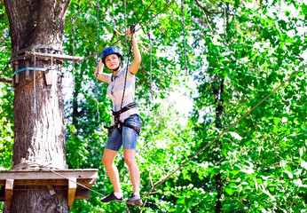 adventure climbing high wire park - people on course in mountain