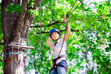 adventure climbing high wire park - people on course in mountain