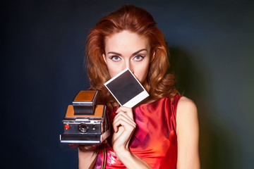 Girl with retro style instant camera.