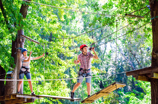 adventure climbing high wire park - people on course in mountain