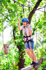 adventure climbing high wire park - people on course in mountain