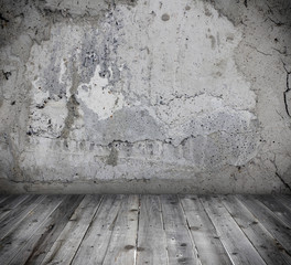 Empty concrete room with planking floor