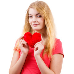 Woman blonde girl holding red heart love symbol