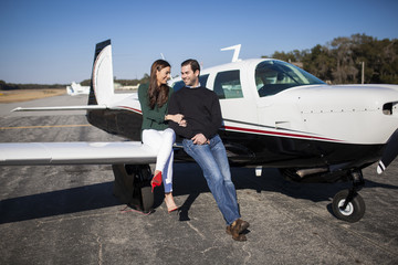 Young couple with private plane