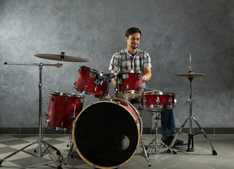 Fototapeta premium Musician playing the drums in a studio