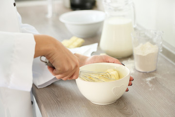 Cooking buttery cream on kitchen