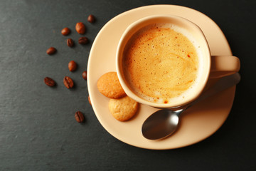 Cup of coffee on gray background
