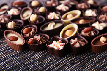 Chocolate sweets on fabric background