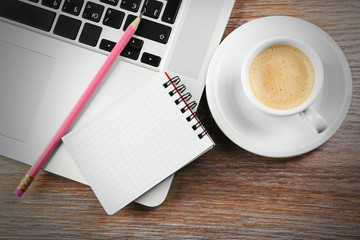 Empty  notebook on laptop keyboard, on light background