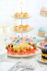 Set of cold snacks, canape, beverages and dessert, closeup