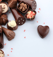 Assorted chocolate candies, isolated on white