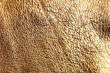 Golden leather texture close up