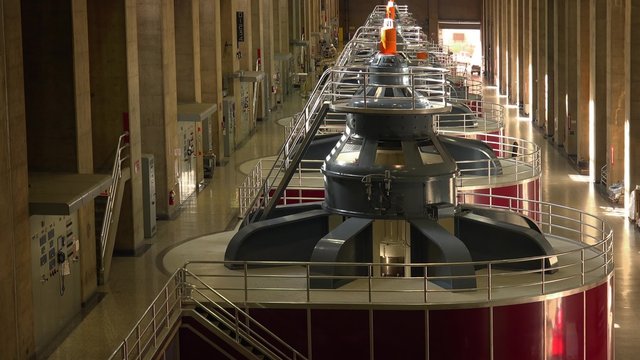 Large turbines spin to create electricity in the powerplant at Hoover Dam