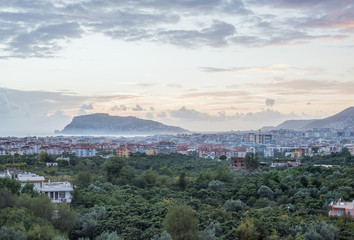 Sunset view of harbor, sea and fortress in Alanya, Turkey.
