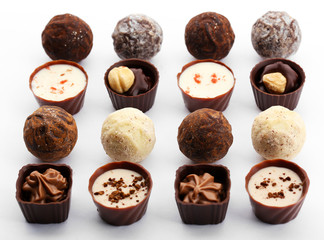 Assorted collection of chocolate candies and sweets, isolated on white