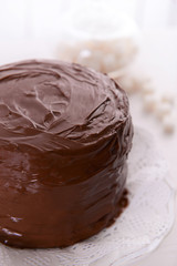 Tasty chocolate cake on light background
