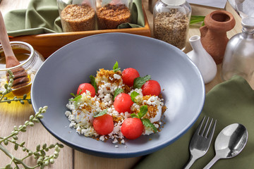 watermelon salad with parmesan and vanilla ice cream served as d