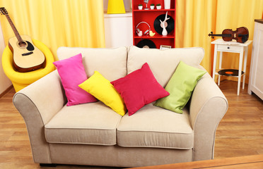 Living room interior with sofa and coloured pillows