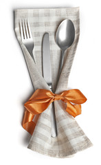 Christmas serving cutlery in a napkin, isolated on white