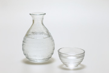 Sake cup and bottle on white background © takadahirohito