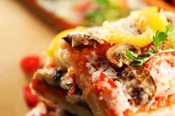 Pieces of delicious pizza on the table, close-up