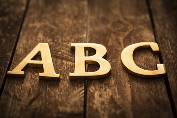 Golden ABC letters On The Wood