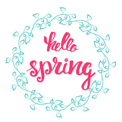 Hello Spring. Hand lettering, calligraphy inscription with spring leaves.