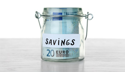 Jar for savings full of coins