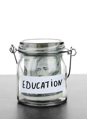 Jar for savings full of banknotes