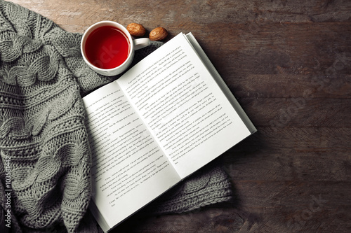 An Open Book A Cup Of Tea And A Blanket On The Wooden Background Wall Mural Africa Studio