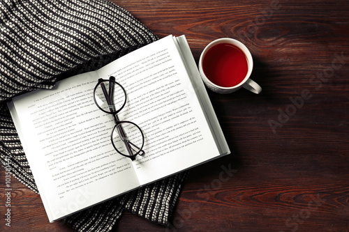 An Open Book A Cup Of Tea Glasses And A Blanket On The Wooden Background Wall Mural Africa Studio An Open Book A Cup Of Tea Glasses And A Blanket On The Wooden Background Wall Mural Africa Studio