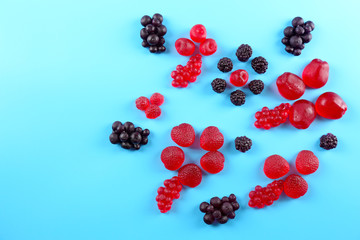 Fruit candies on blue background