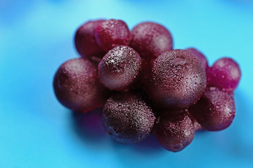 Fruit candies on blue background