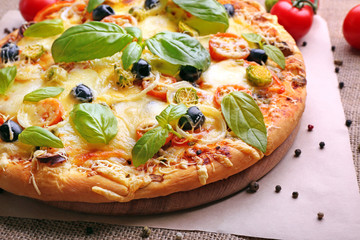 Delicious fresh pizza closeup