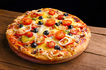 Delicious fresh pizza on black background