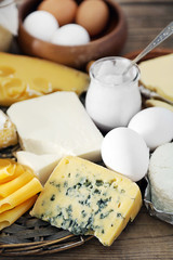 Set of fresh dairy products on old  wooden table, close up