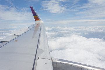 The wings of the plane, and the beautiful view from the glass wi