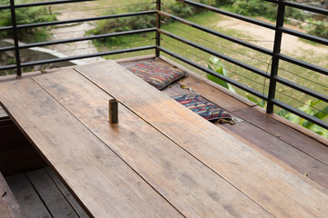 wooden table and seat on the patio