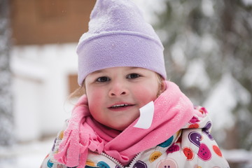 little girl have fun at snowy winter day