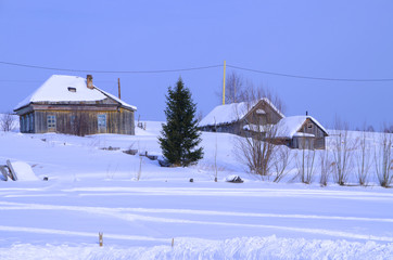 Landscape of the Russian village of the house in the winter
