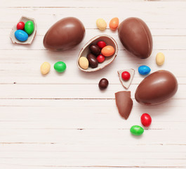 Chocolate Easter Eggs Over Wooden Background