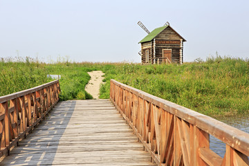 Bridge of love and an old mill. Tourist Complex Siberian Podvorye. 