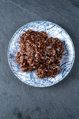 Organic peanut butter & Chocolate No Bake Cookies on a stone cutting board