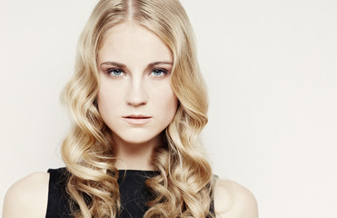 Naklejka premium Picture of blue eyes woman with curly hair.
