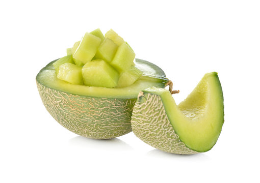 half and portion cut ripe honeydew melon on white background