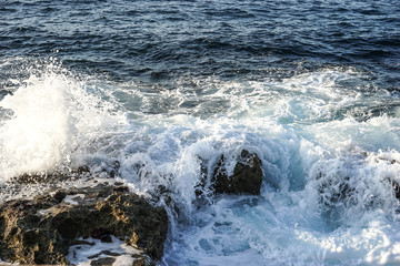 waves breaking on a stony beach