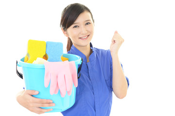 ガッツポーズの女性清掃員