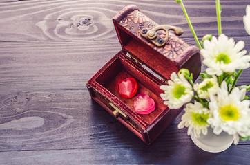 Valentines day background with two pink hearts in classic box wi