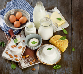 Tasty healthy dairy products on rustic wooden table.