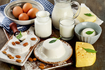 Tasty healthy dairy products on a rustic wooden table.